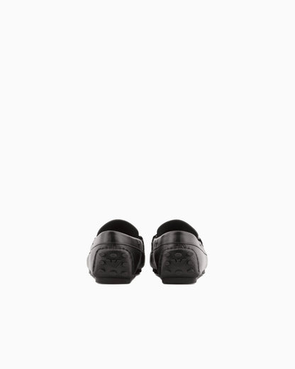 Stirrup bar loafer in pebbled leather with a studded sole