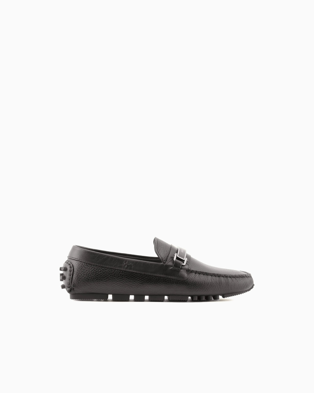 Stirrup bar loafer in pebbled leather with a studded sole