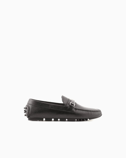 Stirrup bar loafer in pebbled leather with a studded sole