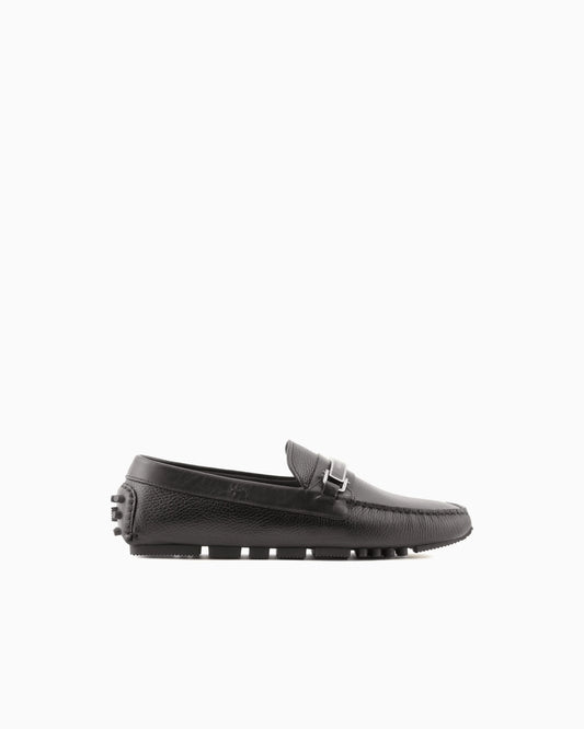 Stirrup bar loafer in pebbled leather with a studded sole