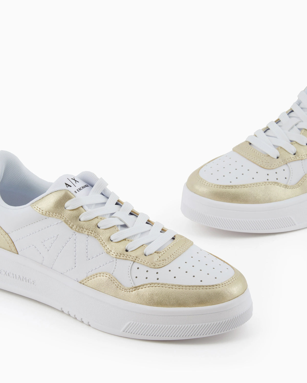 Sneakers with metallic inserts