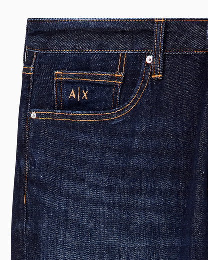Slim-fit five-pocket denim jeans with a leather patch