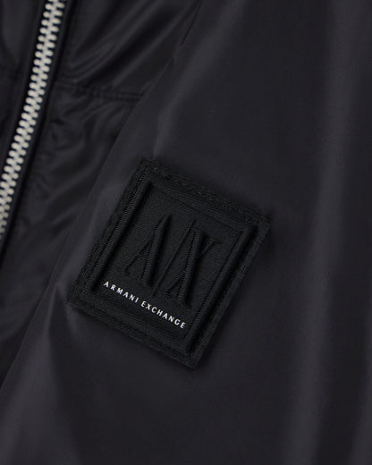 Hooded nylon windbreaker Icon with a zip and logo patch