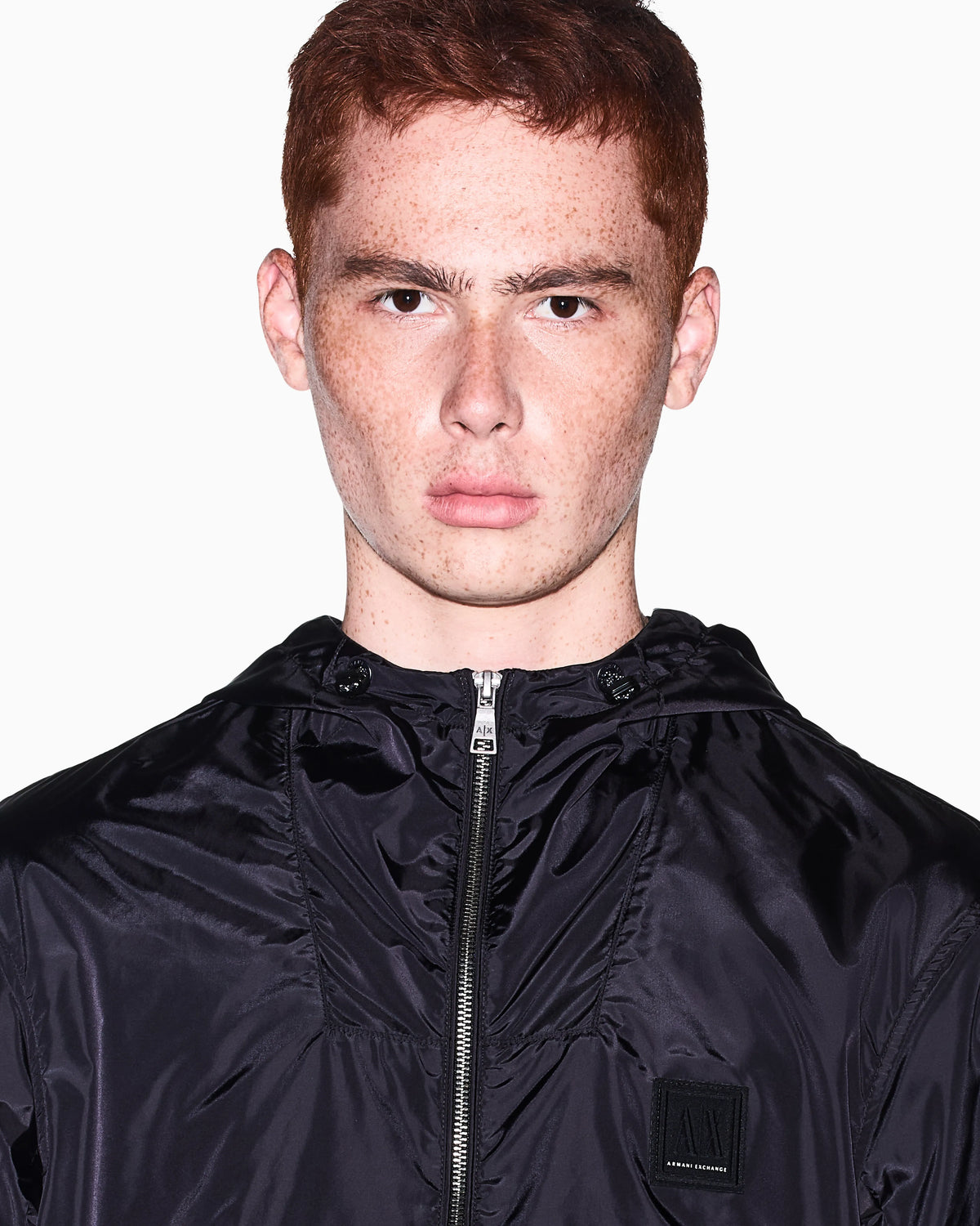 Hooded nylon windbreaker Icon with a zip and logo patch
