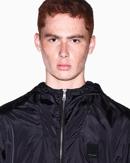 Hooded nylon windbreaker Icon with a zip and logo patch