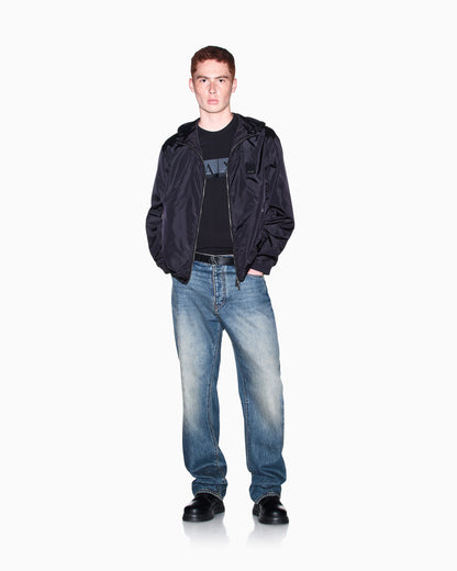 Hooded nylon windbreaker Icon with a zip and logo patch