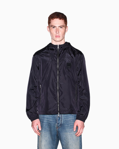 Hooded nylon windbreaker Icon with a zip and logo patch