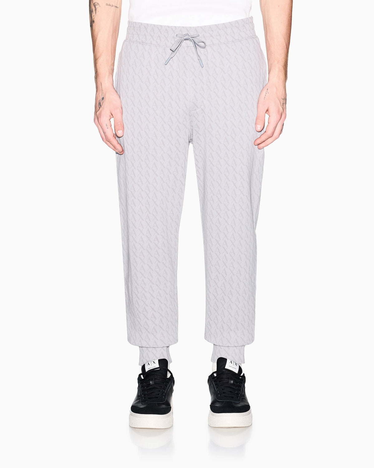Jogger pants in cotton with all-over monogram Essential
