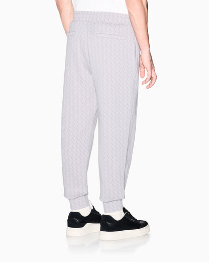 Jogger pants in cotton with all-over monogram Essential