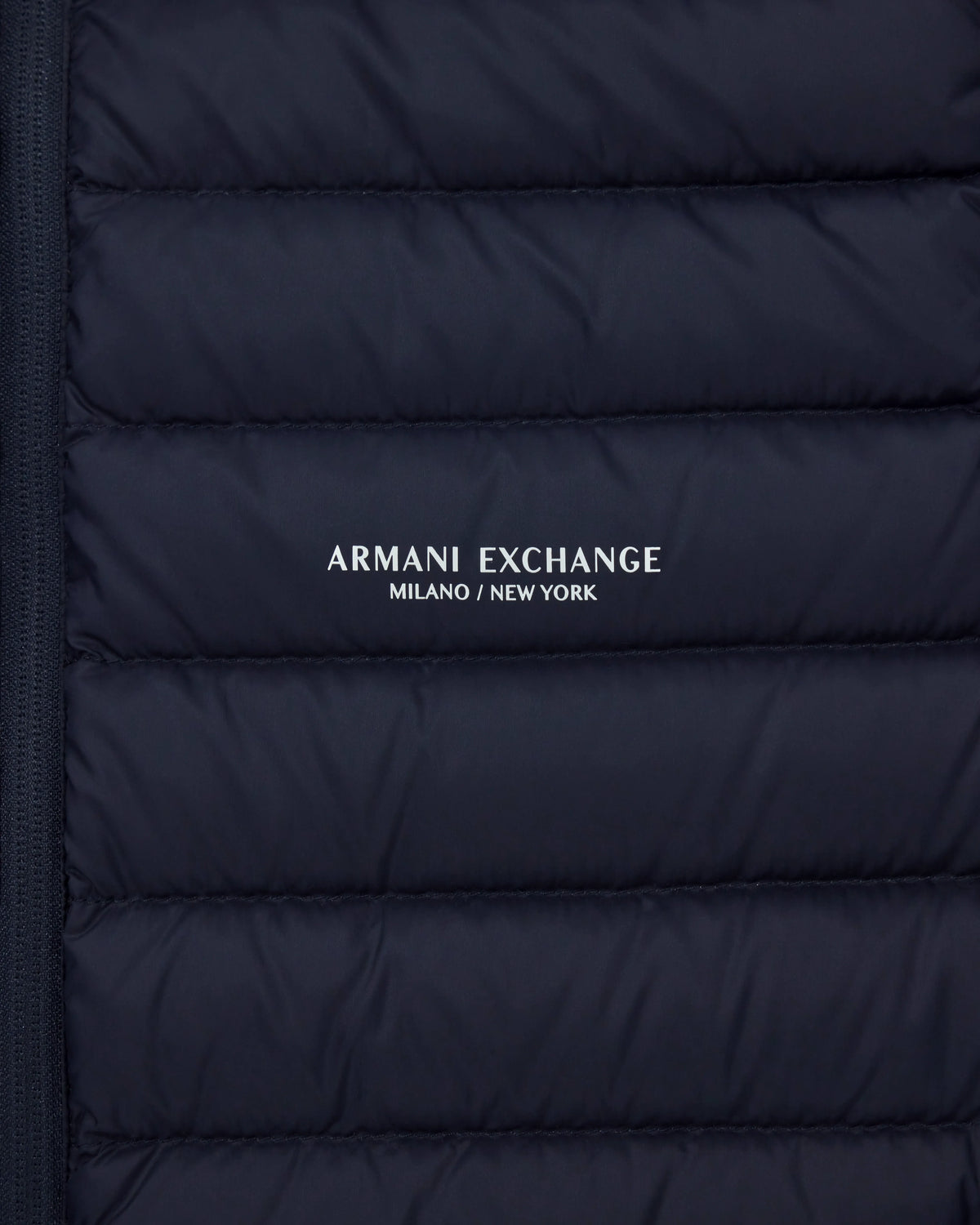 Quilted full-zip down vest with a high collar Essential