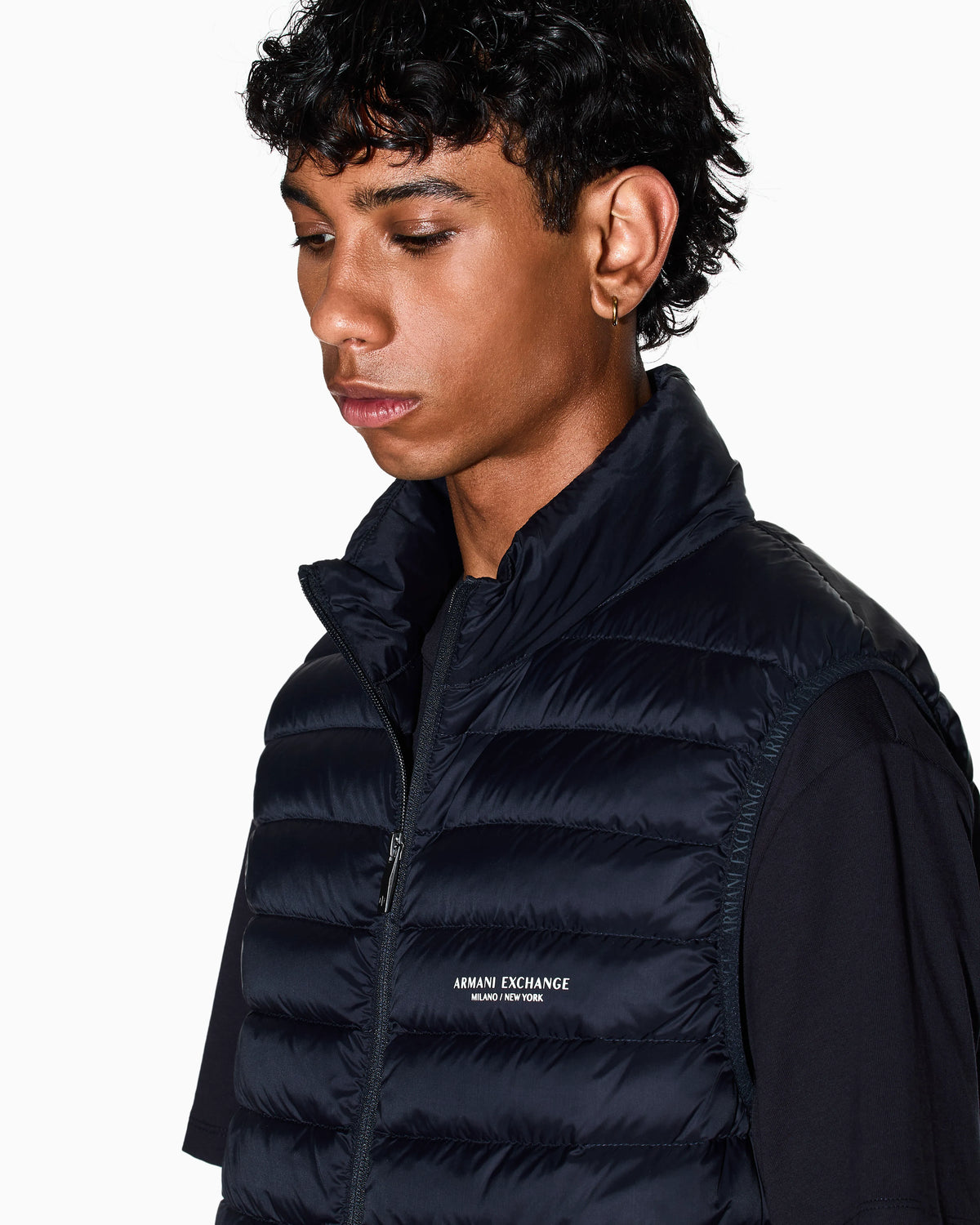 Quilted full-zip down vest with a high collar Essential