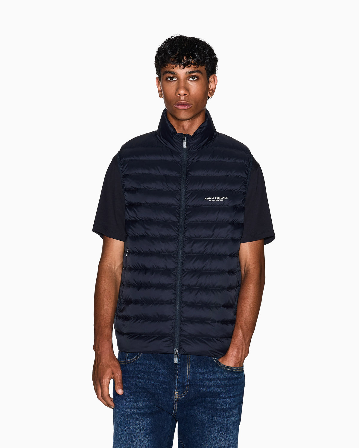 Quilted full-zip down vest with a high collar Essential