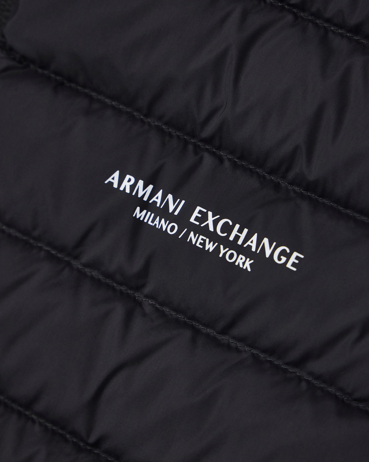 Quilted full-zip down vest with a high collar Essential