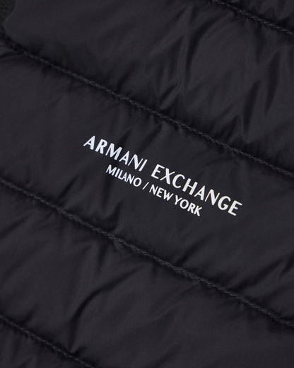 Quilted full-zip down vest with a high collar Essential