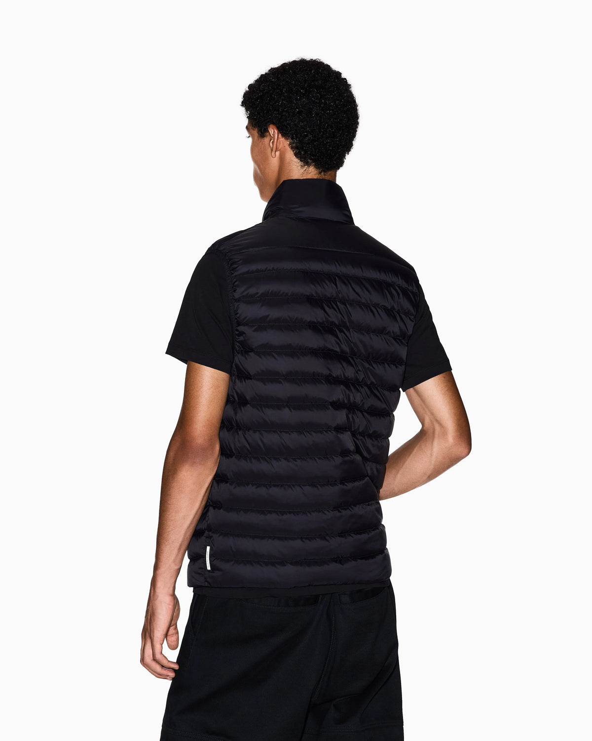 Quilted full-zip down vest with a high collar Essential