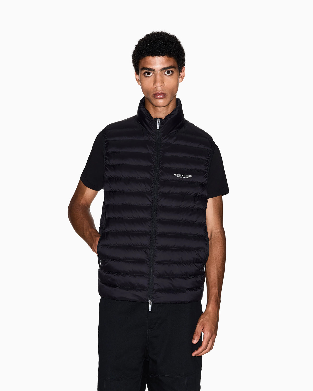 Quilted full-zip down vest with a high collar Essential