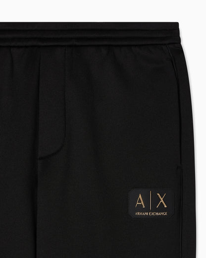 Jogger pants with metal logo