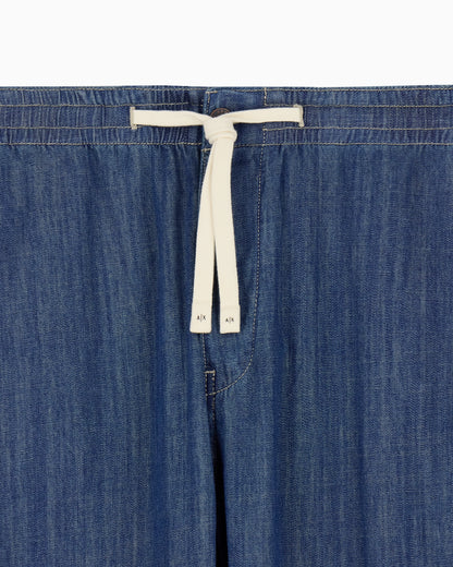 Washed cotton denim pants with an elastic drawstring waist