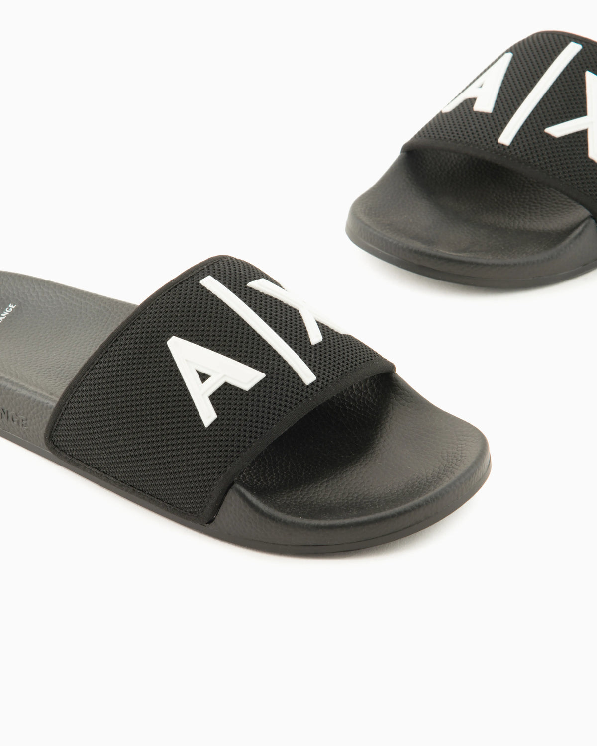 Slide sandals with a wide strap and textured rubber sole