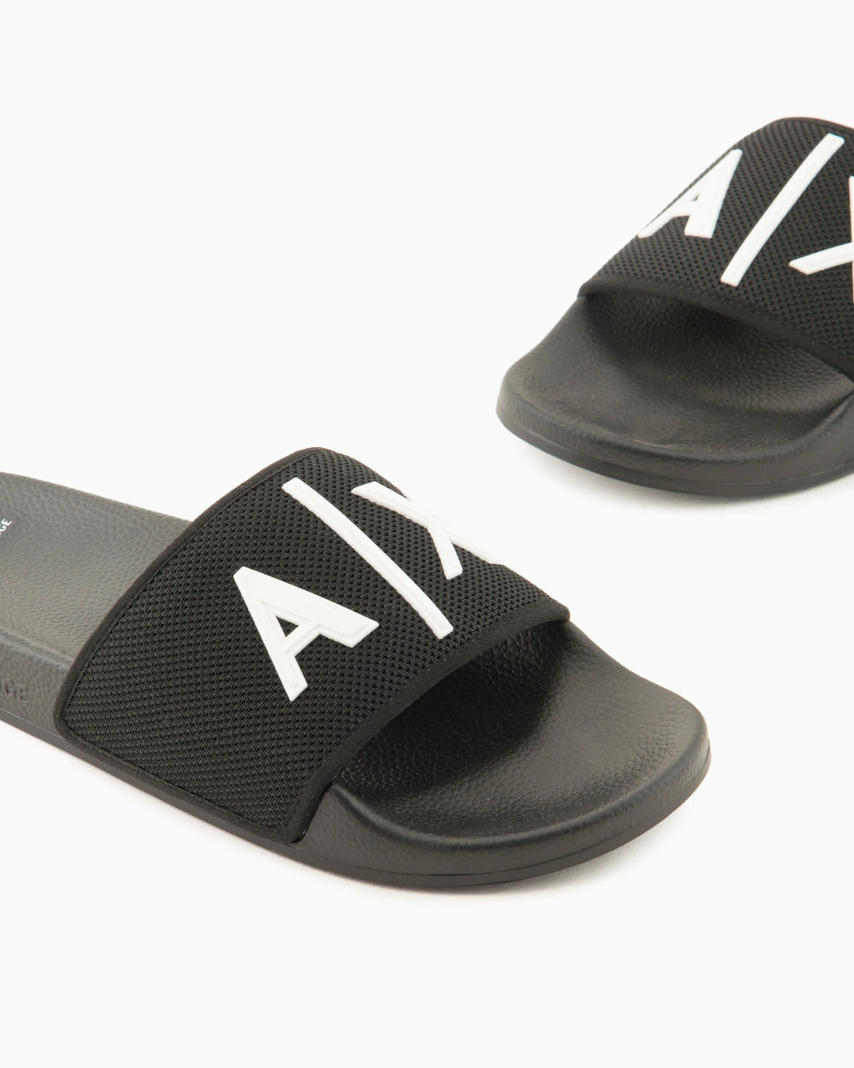Slide sandals with a wide strap and textured rubber sole