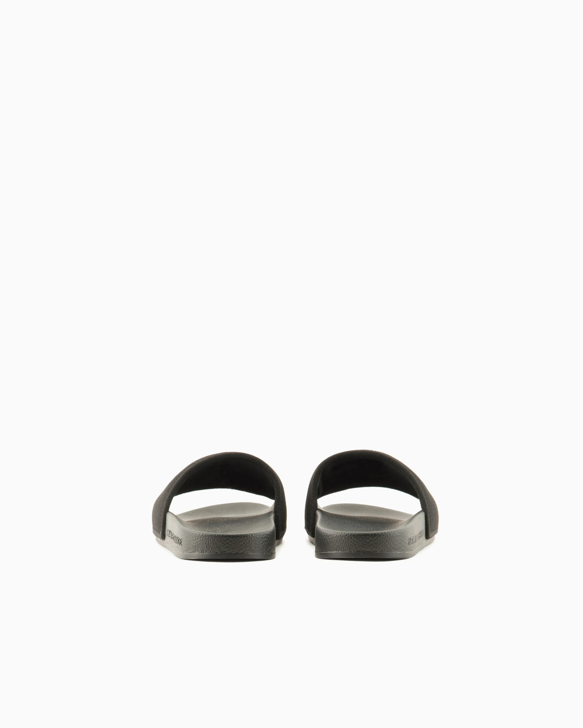 Slide sandals with a wide strap and textured rubber sole