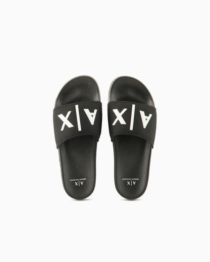 Slide sandals with a wide strap and textured rubber sole