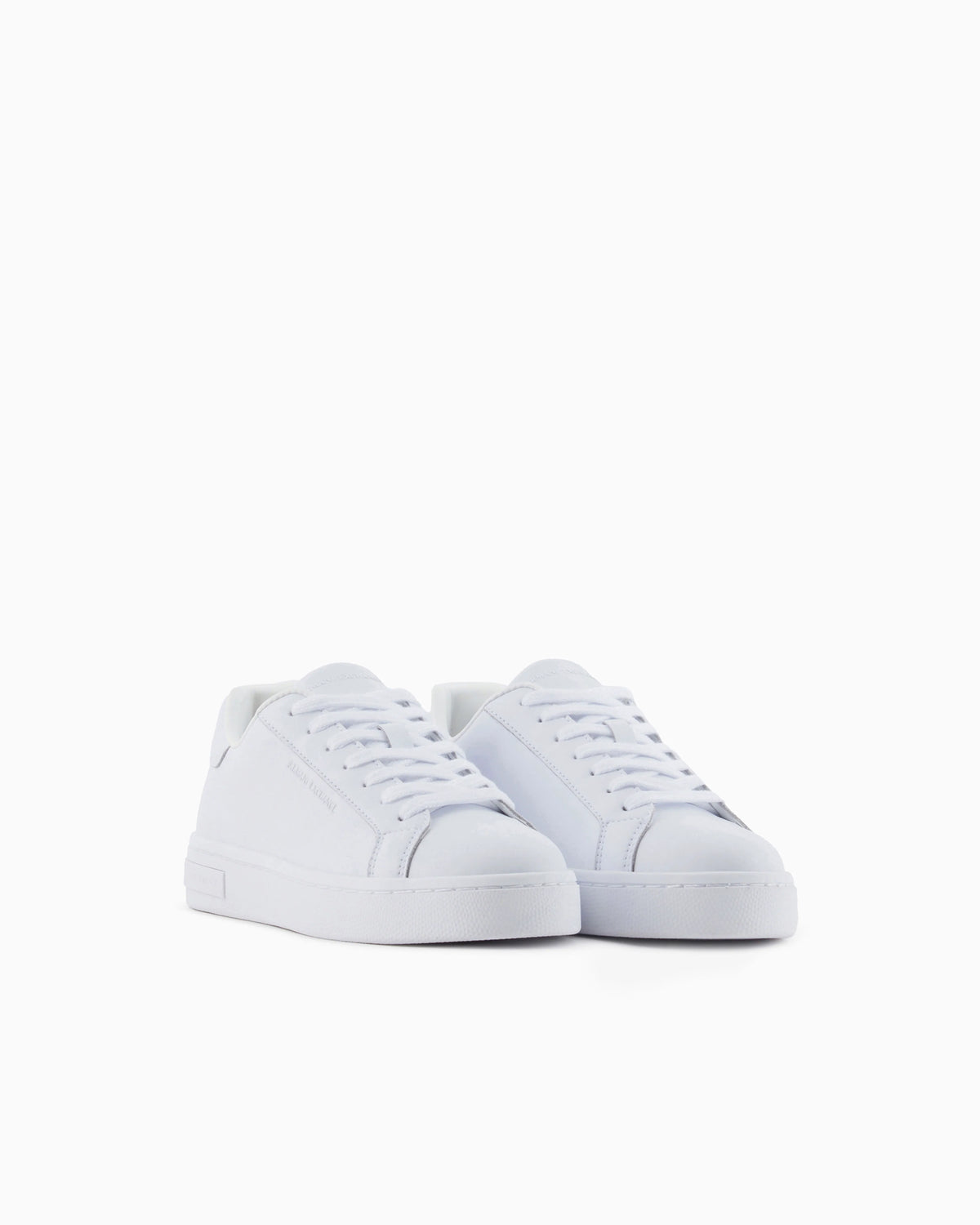 Low-top sneakers in smooth leather with an embossed logo