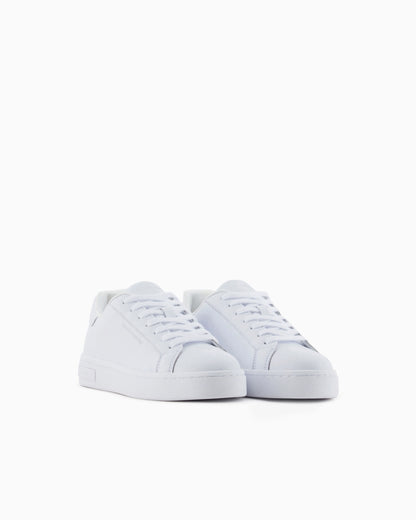 Low-top sneakers in smooth leather with an embossed logo