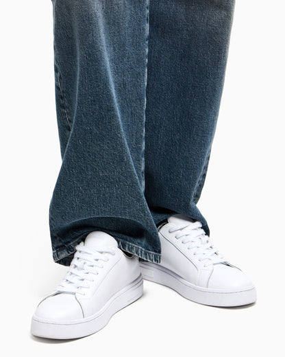 Low-top sneakers in smooth leather with an embossed logo