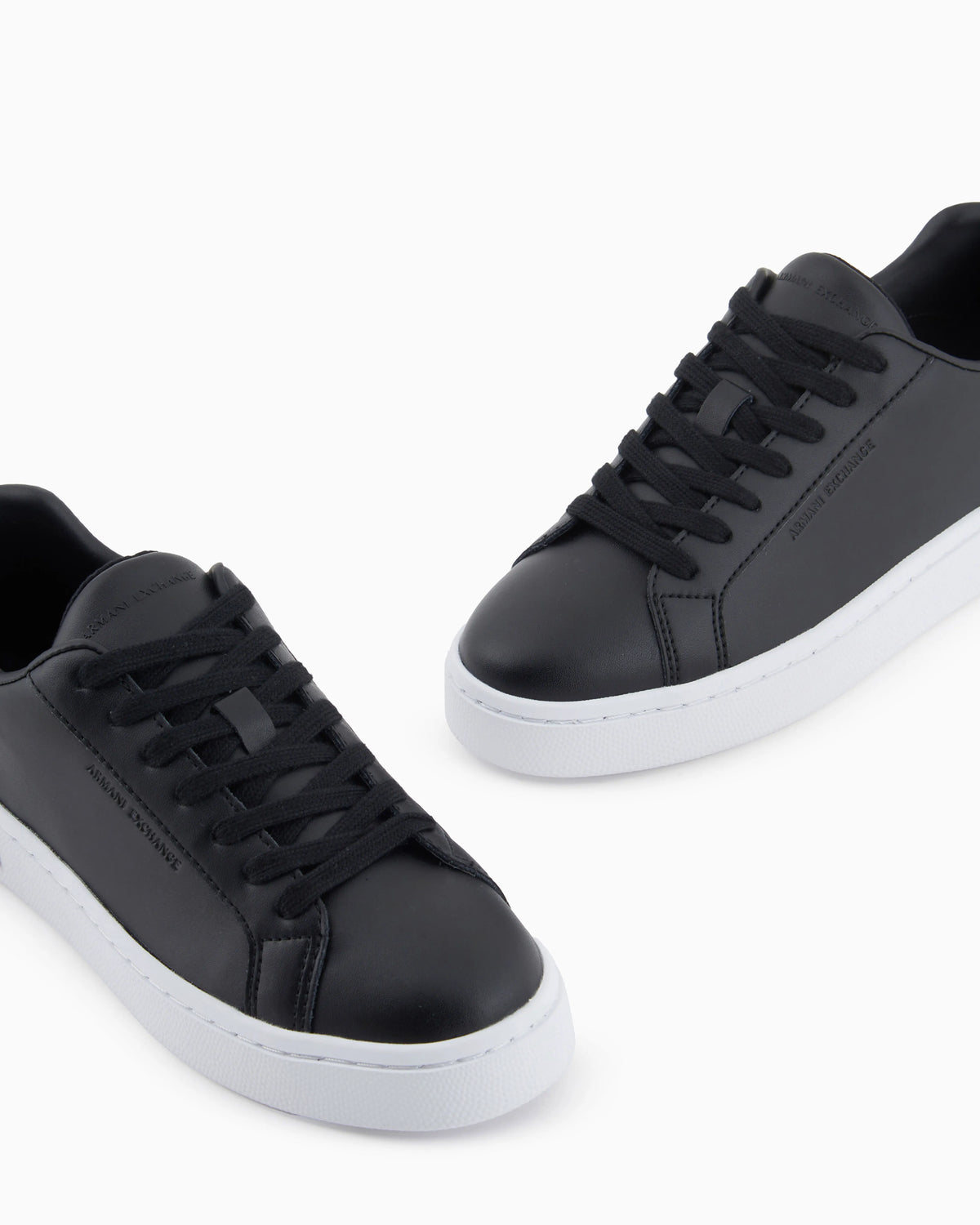 Low-top sneakers in smooth leather with an embossed logo
