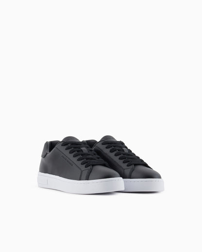 Low-top sneakers in smooth leather with an embossed logo
