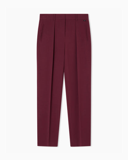 Trousers with pleats in flowing fabric