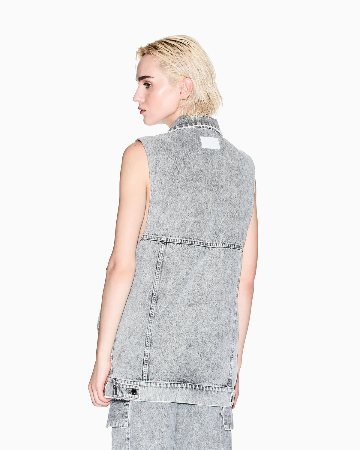 Long vest in stone washed denim