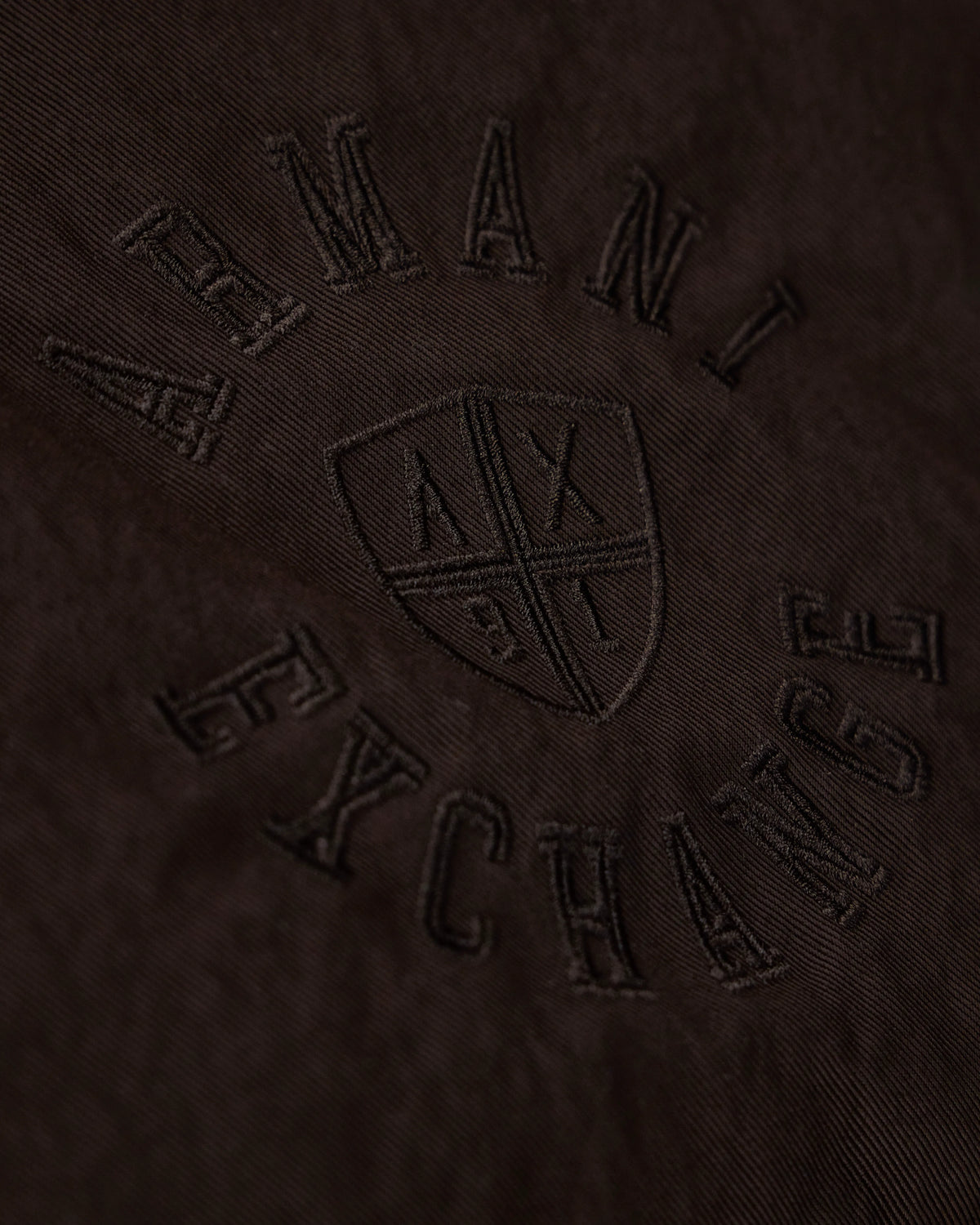 Quilted nylon twill puffer jacket with a high collar