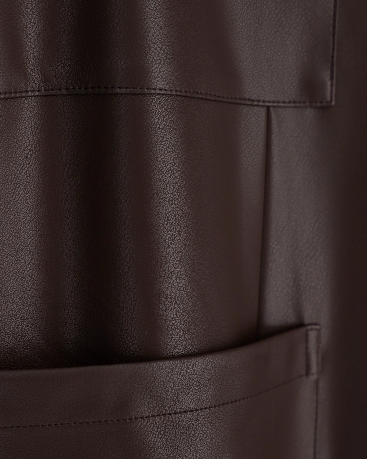 Oversized fit trousers in a coated fabric with rib details