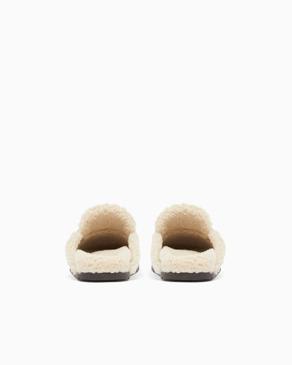 Suede clogs with teddy details