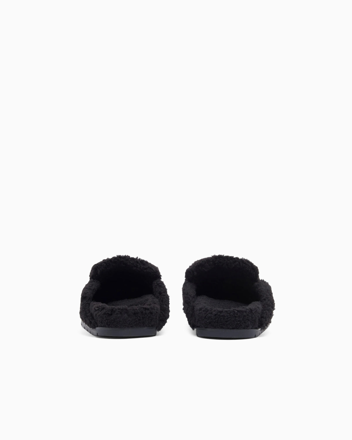 Suede clogs with teddy details