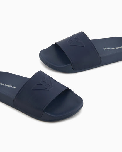Slides with oversized, embossed logo