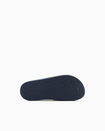 Slides with oversized, embossed logo
