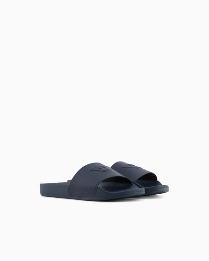 Slides with oversized, embossed logo