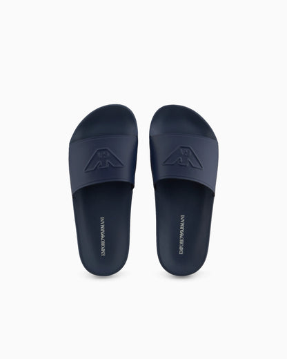 Slides with oversized, embossed logo